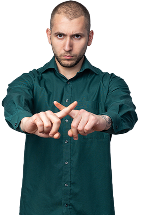 Man in green shirt crossing arms